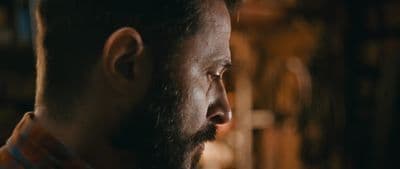 a close up of a man with a beard