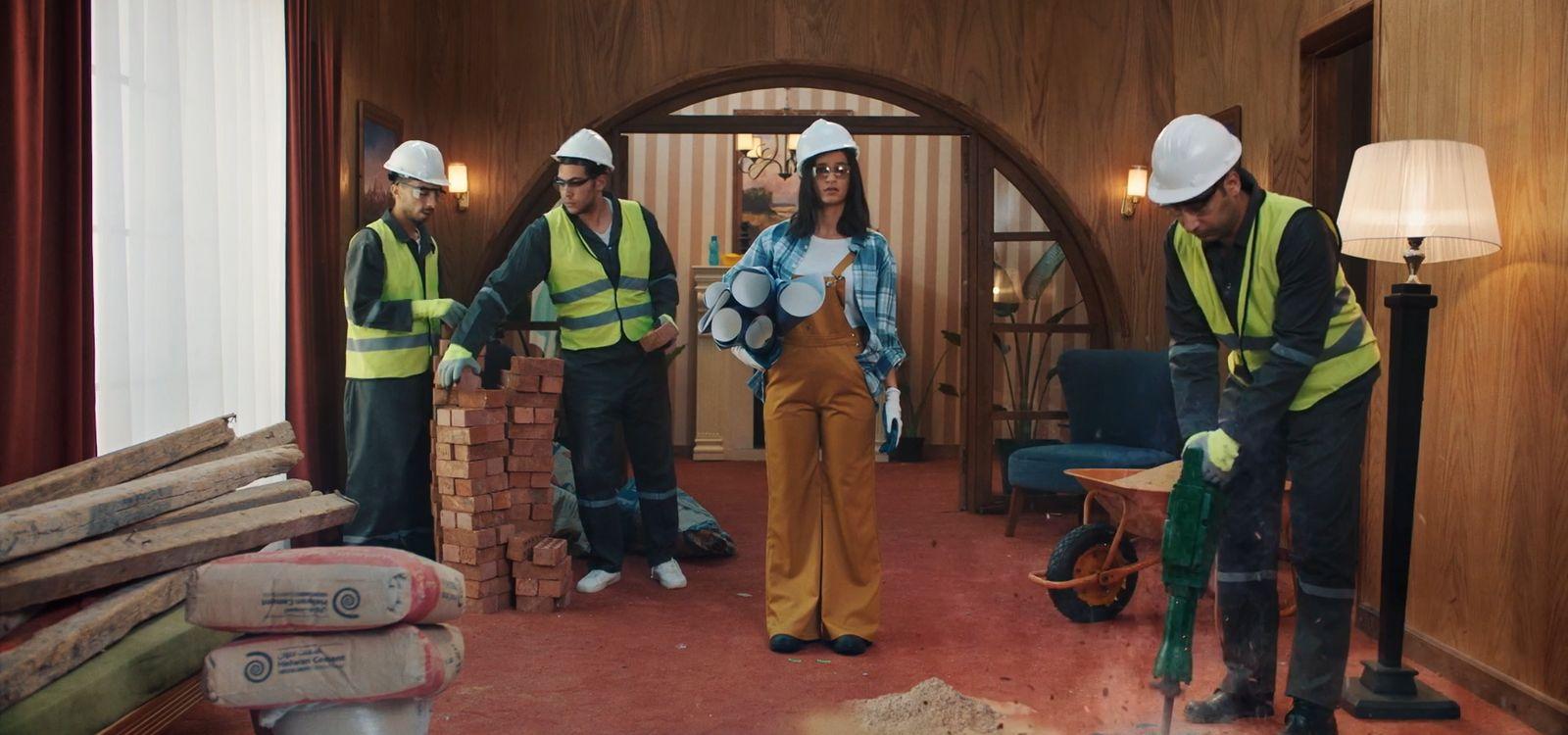 a group of construction workers standing in a room