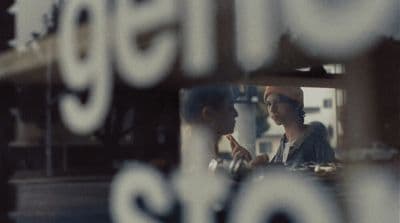 a couple of people that are looking in a mirror