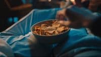 a bowl of food sitting on top of a table