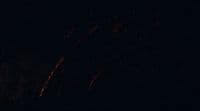 a blurry photo of a fire in the dark