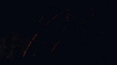 a blurry photo of a fire in the dark