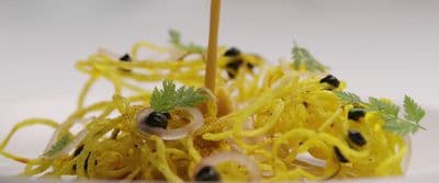 a close up of a plate of food with noodles