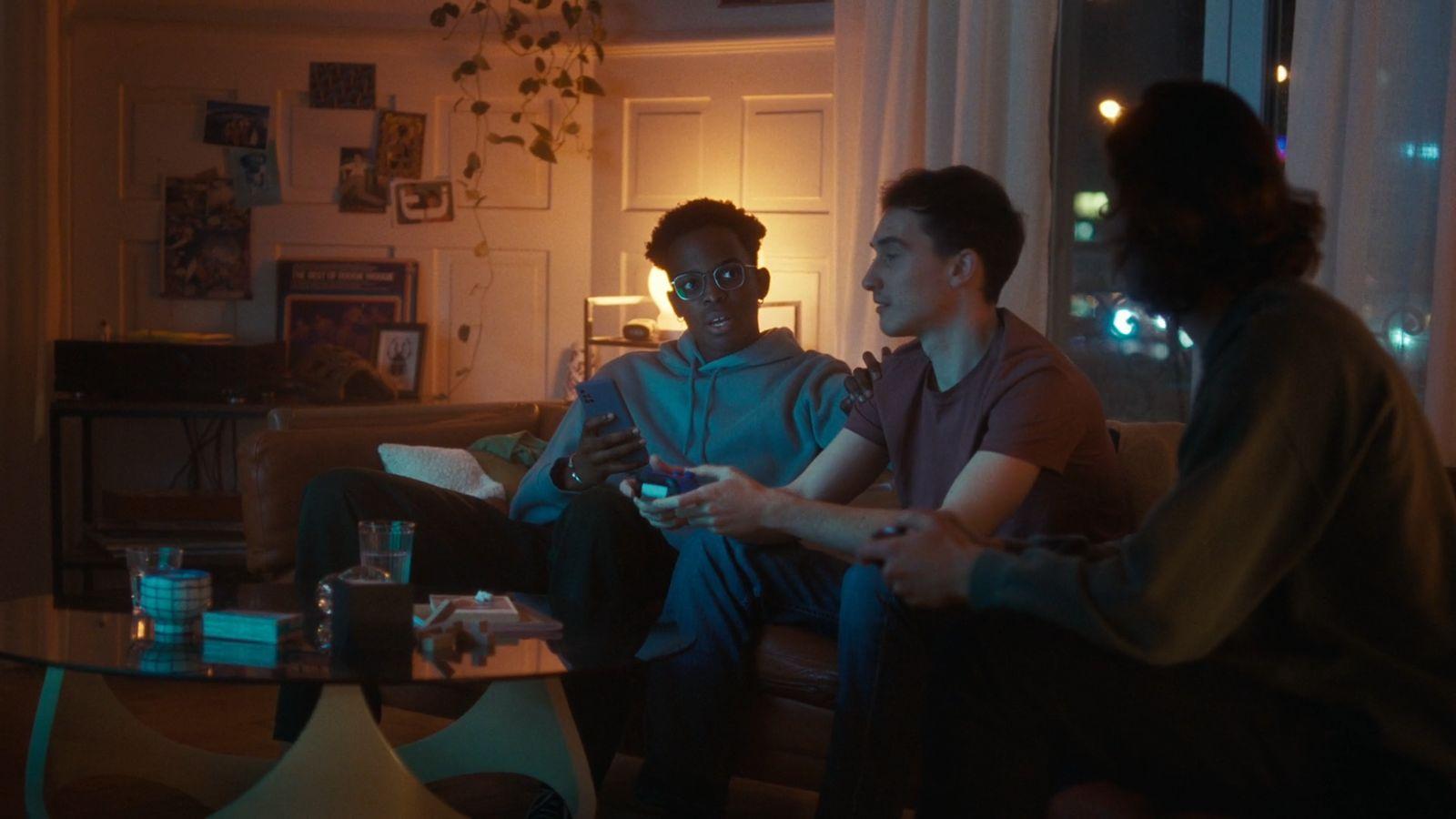a group of people sitting around a living room together