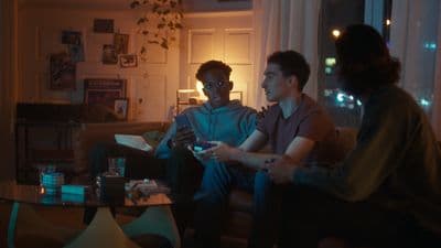 a group of people sitting around a living room together