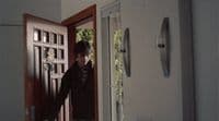 a man standing in front of a door