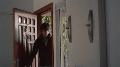 a man standing in front of a door
