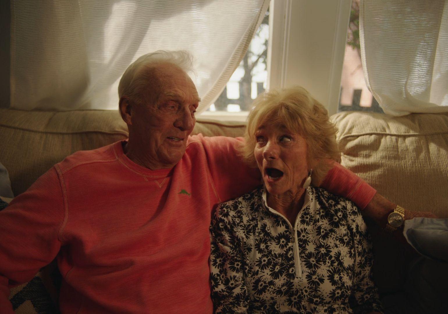 a man and a woman sitting on a couch