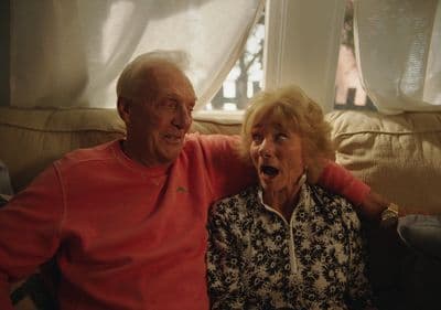 a man and a woman sitting on a couch
