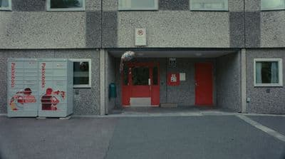 a building with a red door and a red door