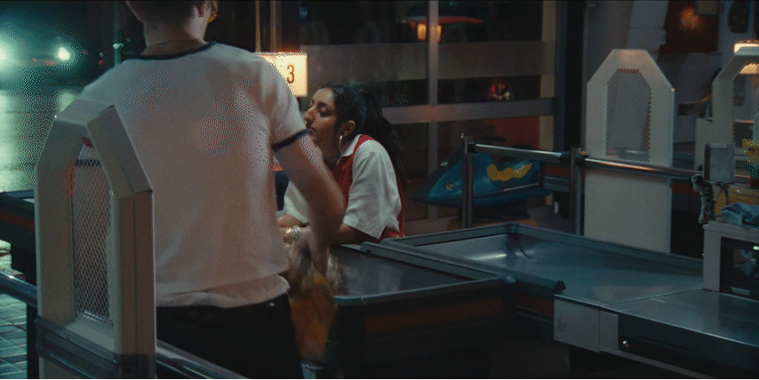 a man standing next to a woman in a kitchen
