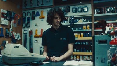 a man standing in front of a machine in a store