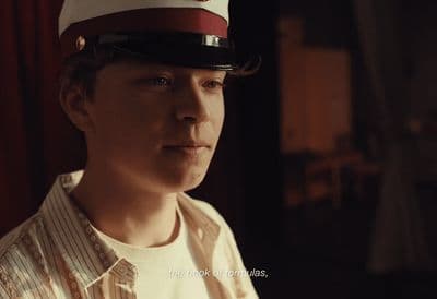 a man wearing a red and white hat