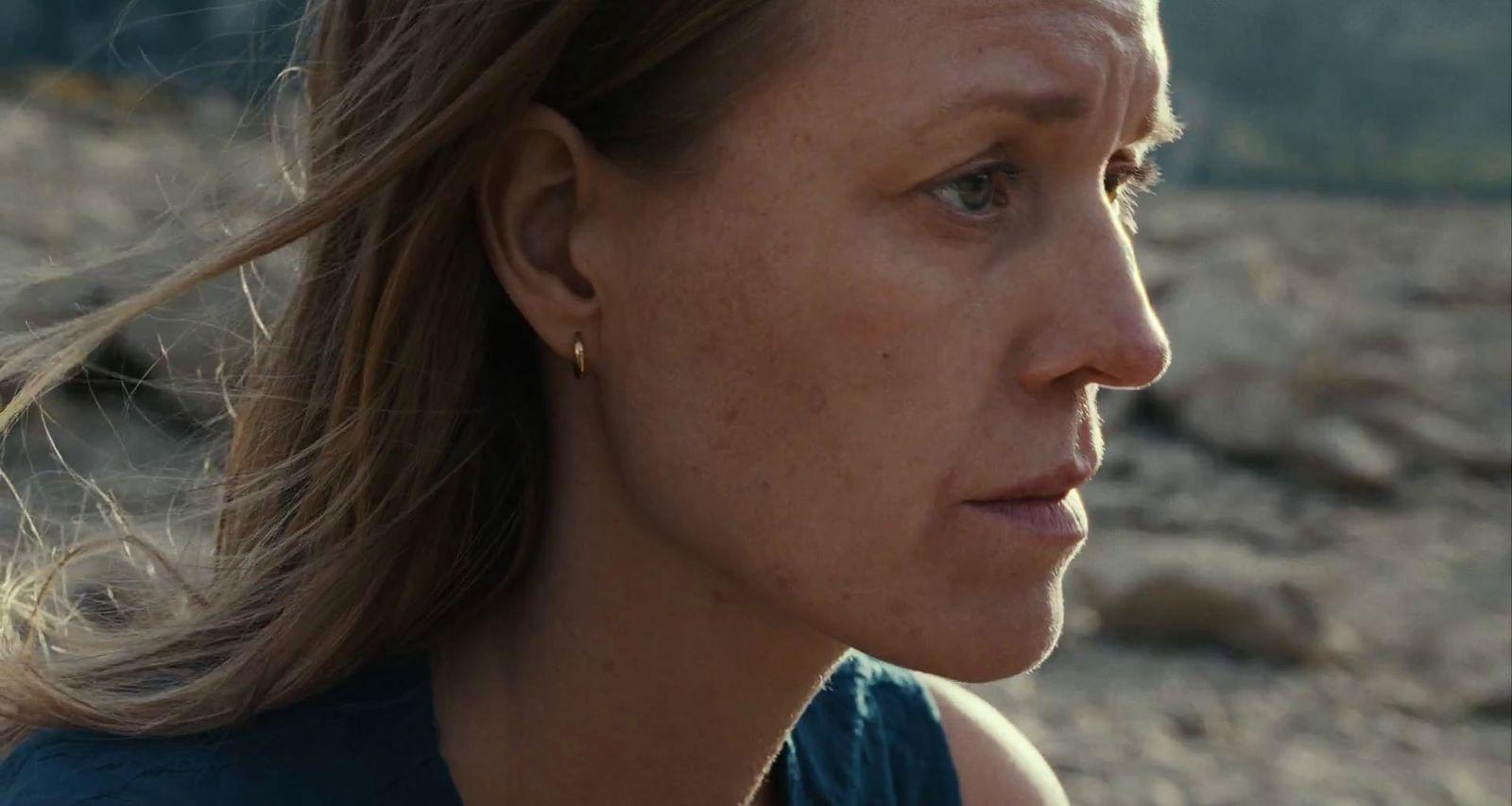 a close up of a woman with a concerned look on her face