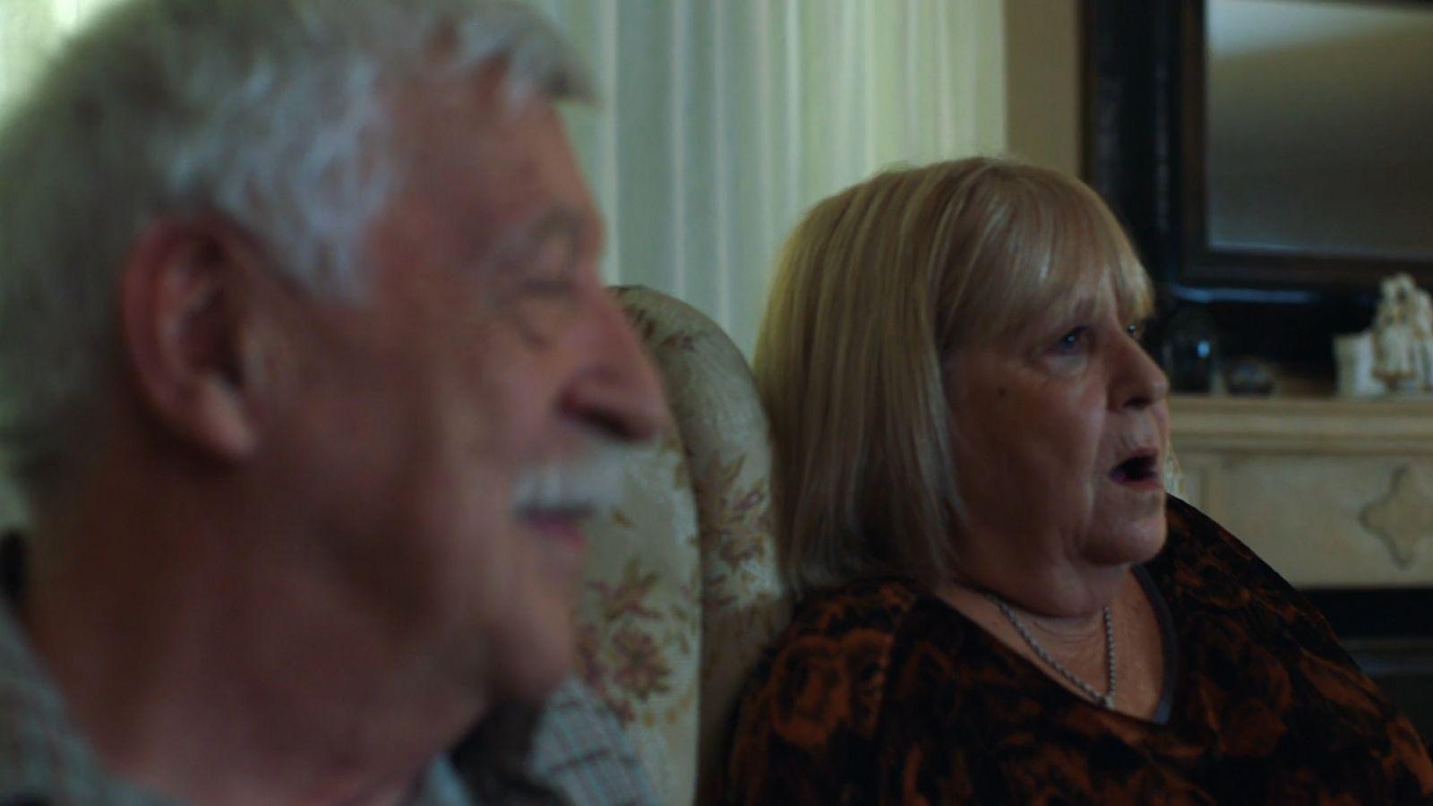 a man and a woman sitting next to each other