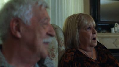 a man and a woman sitting next to each other