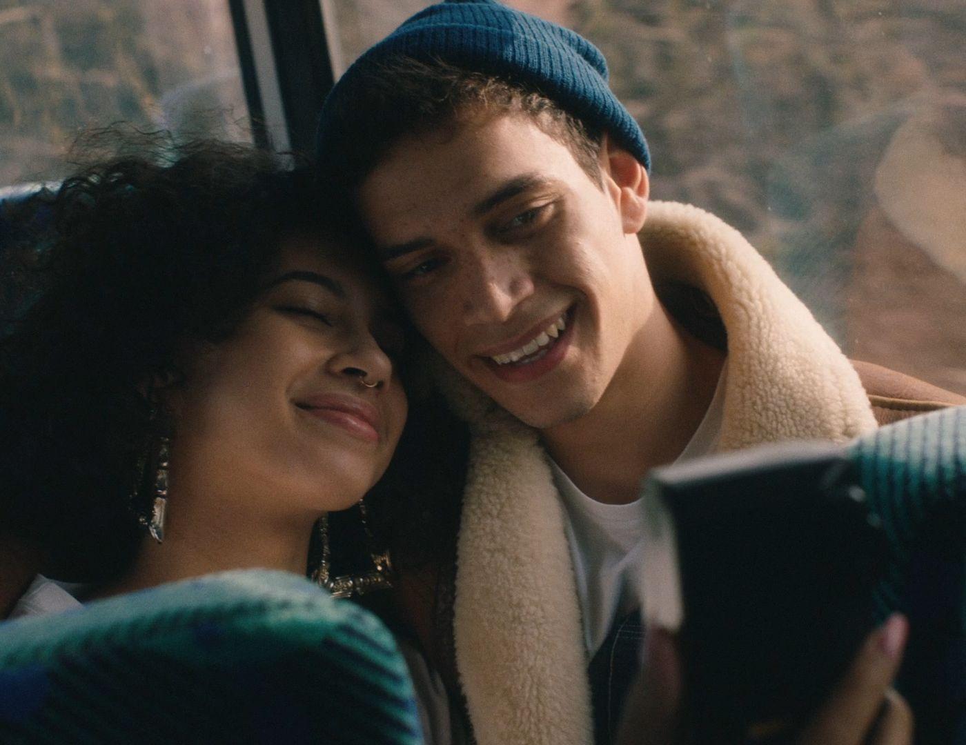a man and a woman sitting next to each other