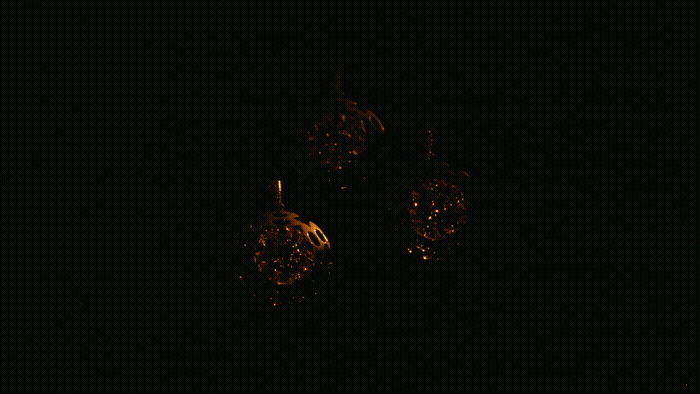 a pair of earrings sitting on top of a table