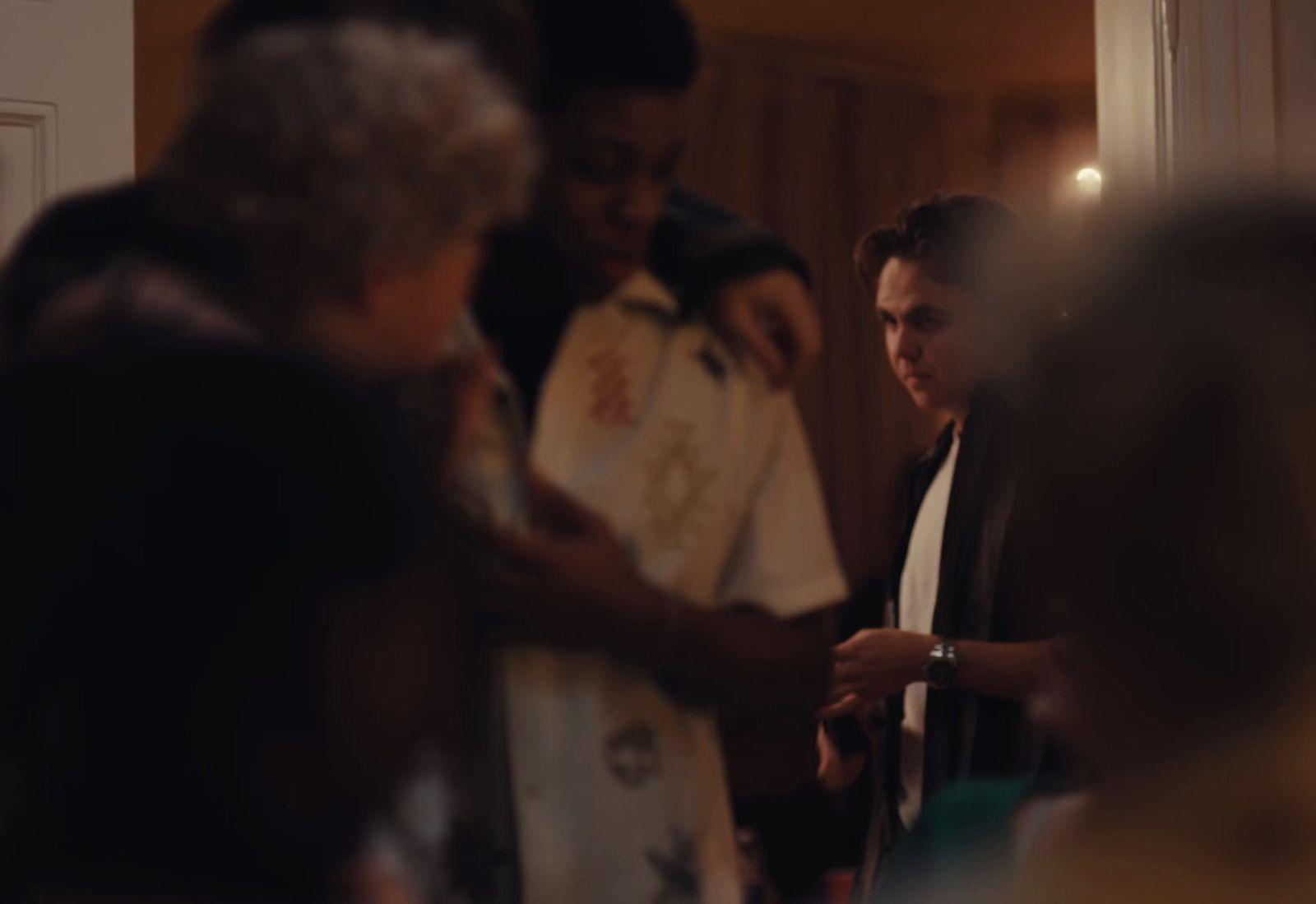 a group of people standing around each other