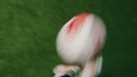 a blurry photo of a person holding a football