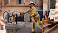 a fireman is using a hose to put out a fire