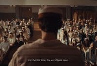 a man standing in front of a crowd of people