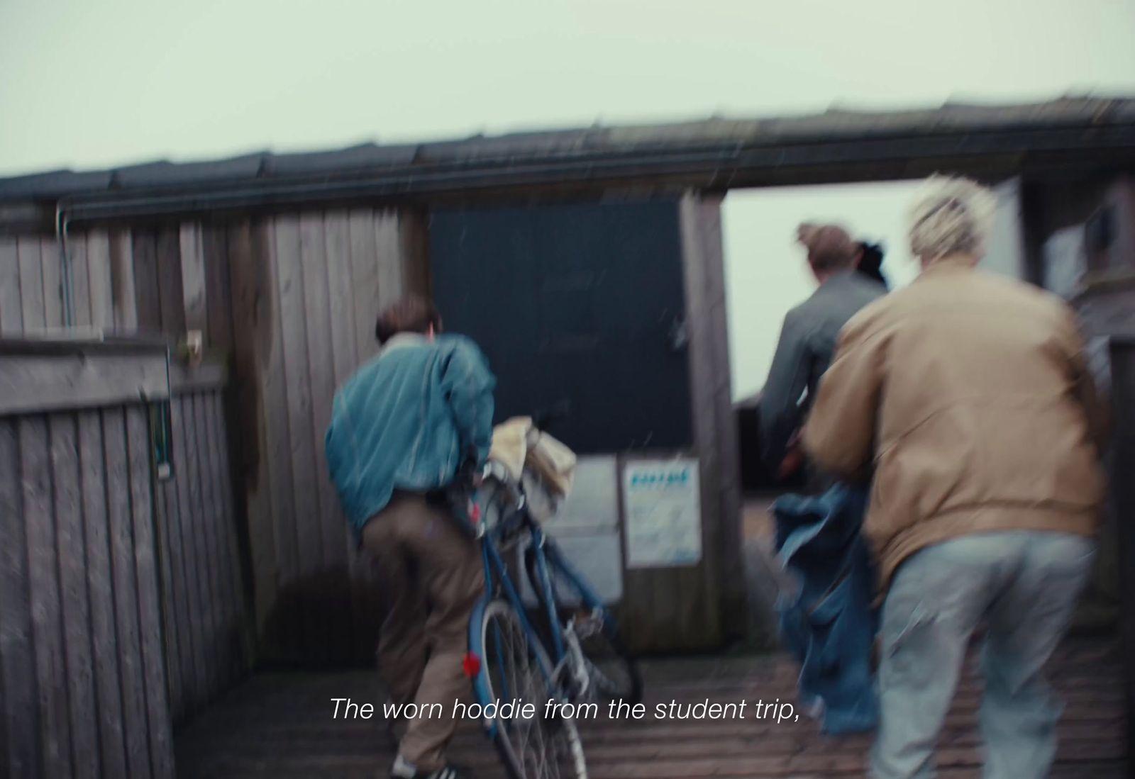 a blurry photo of a person walking a bike