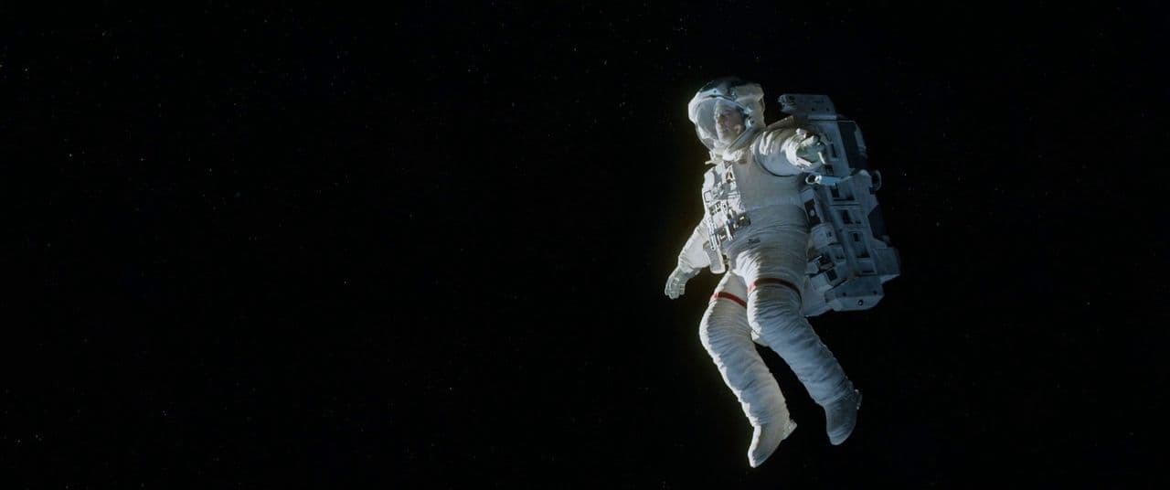 an astronaut floating in the air in space