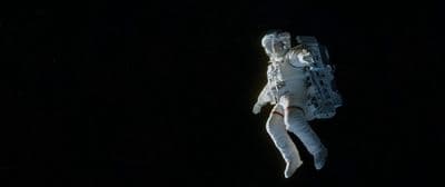 an astronaut floating in the air in space