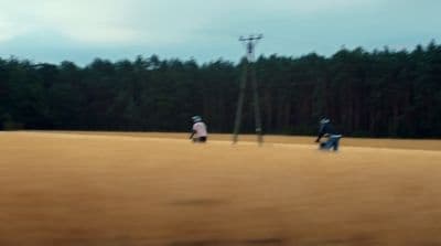 a group of people playing a game of frisbee