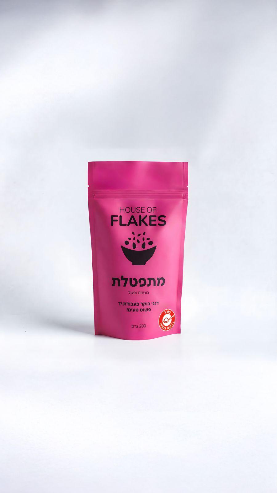 a pink bag of flakes on a white background