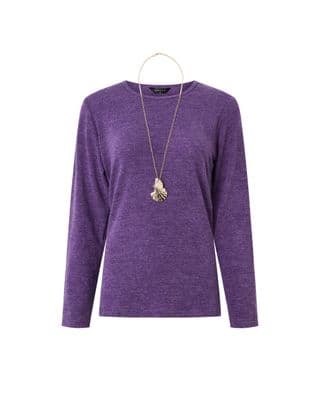 a woman wearing a purple sweater and a necklace
