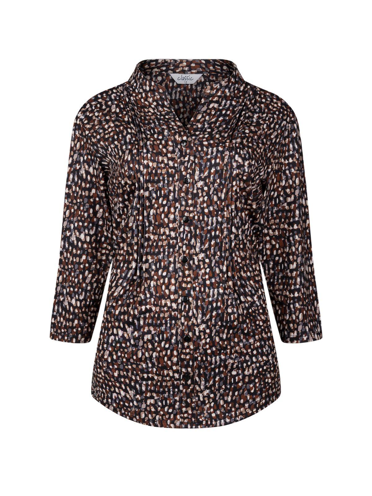 a women's blouse with a leopard print