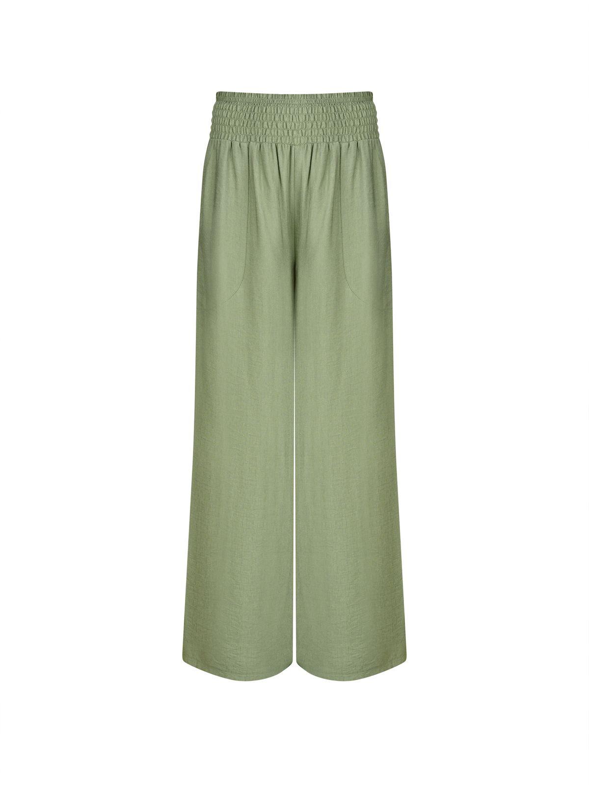 a picture of a woman wearing a pair of green pants