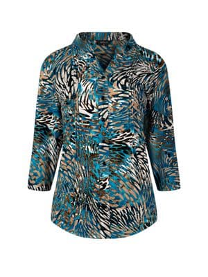 a woman wearing a blue and black shirt with a pattern on it