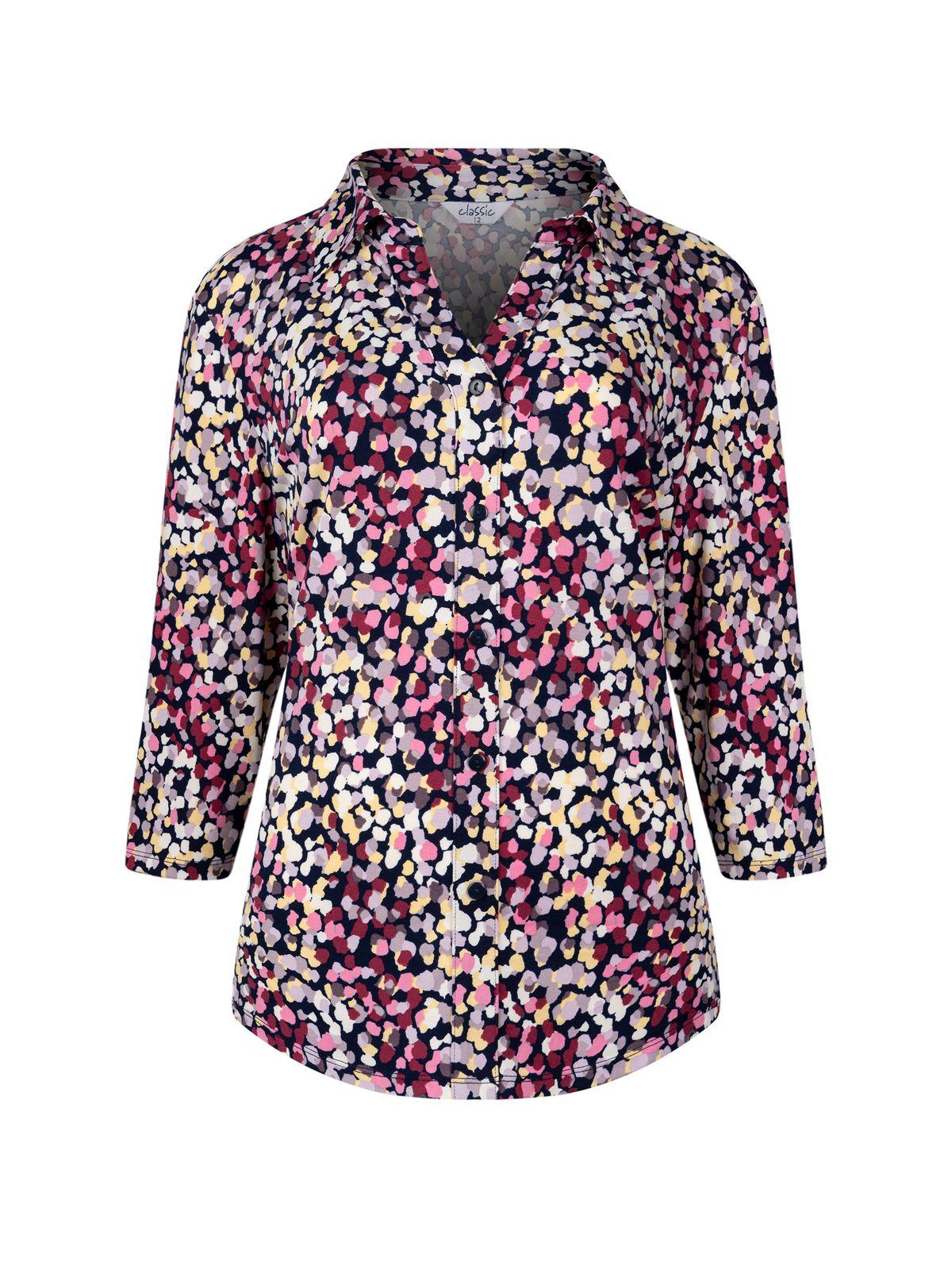 a women's blouse with a multicolored pattern
