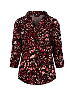 a women's blouse with a floral pattern