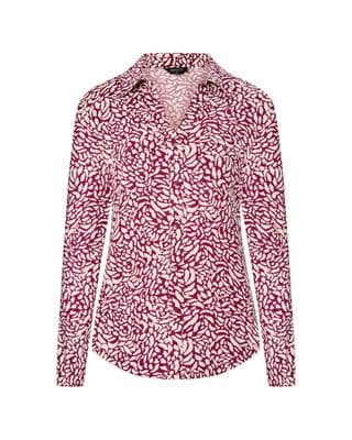 a woman wearing a red and white shirt