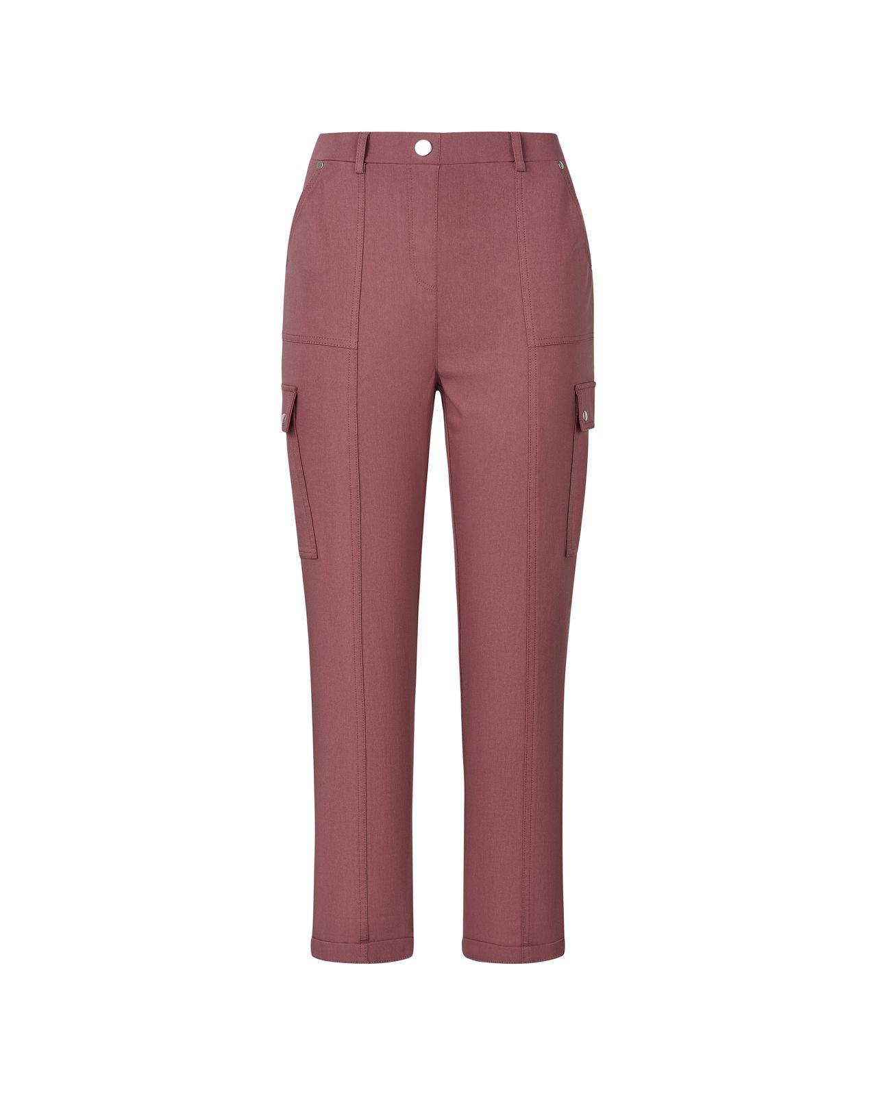 a woman wearing a pink pants with pockets
