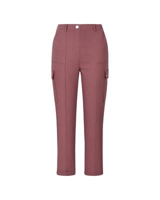 a woman wearing a pink pants with pockets