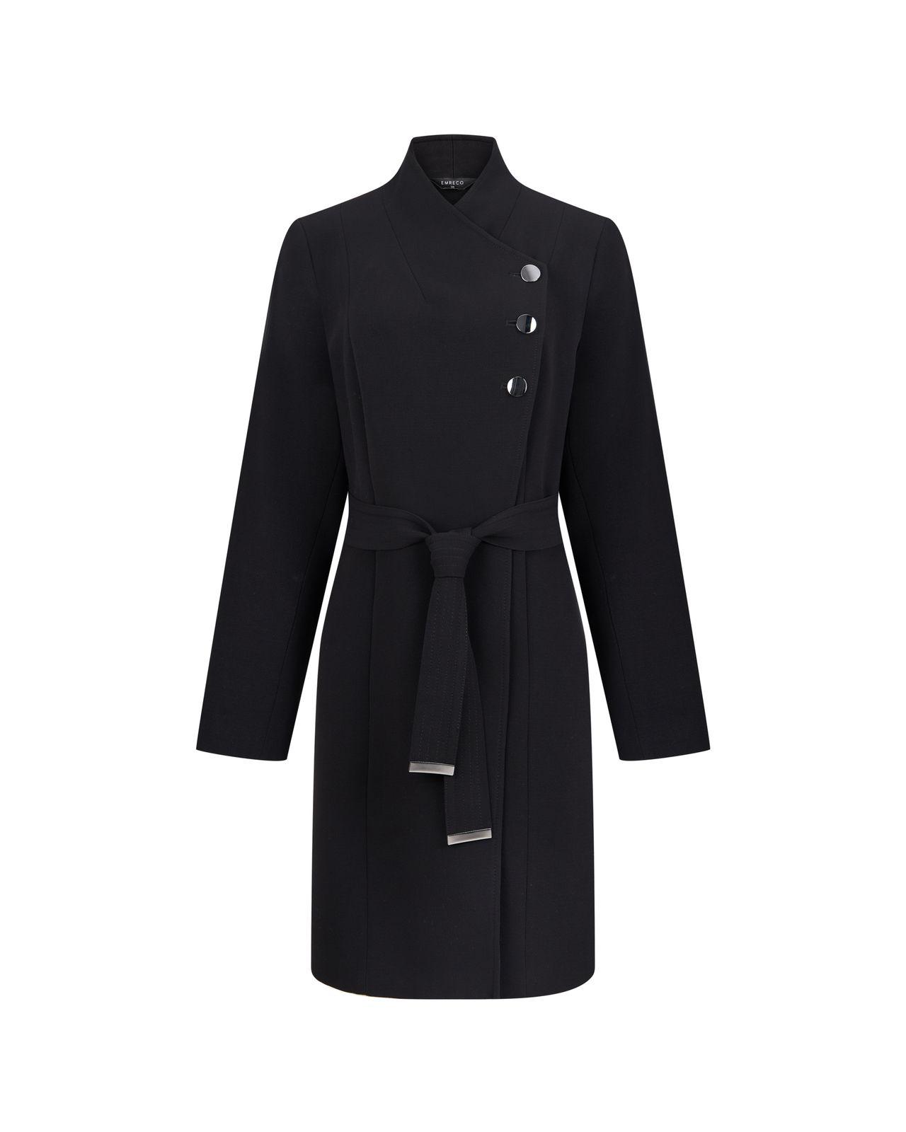 a woman wearing a black coat with buttons