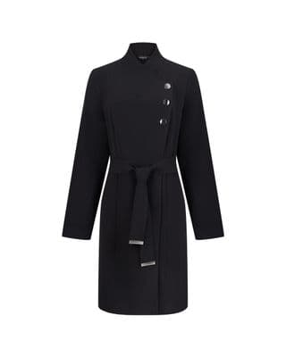 a woman wearing a black coat with buttons