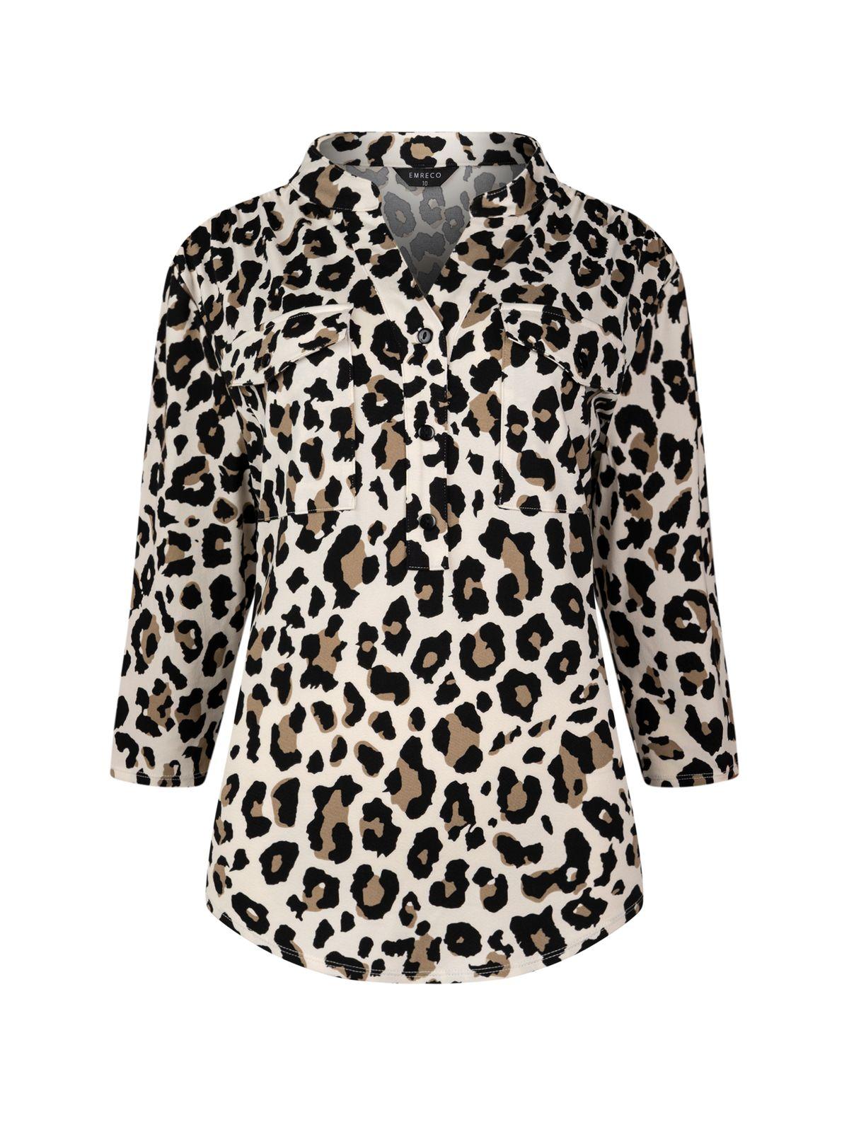a woman wearing a leopard print jacket