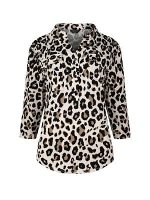 a woman wearing a leopard print jacket