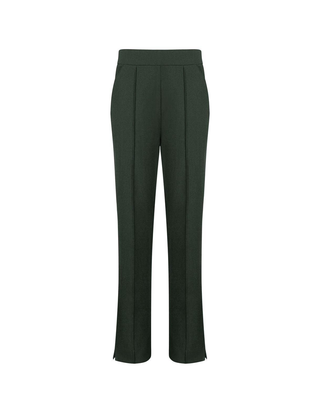 a woman wearing a green pants and a white shirt