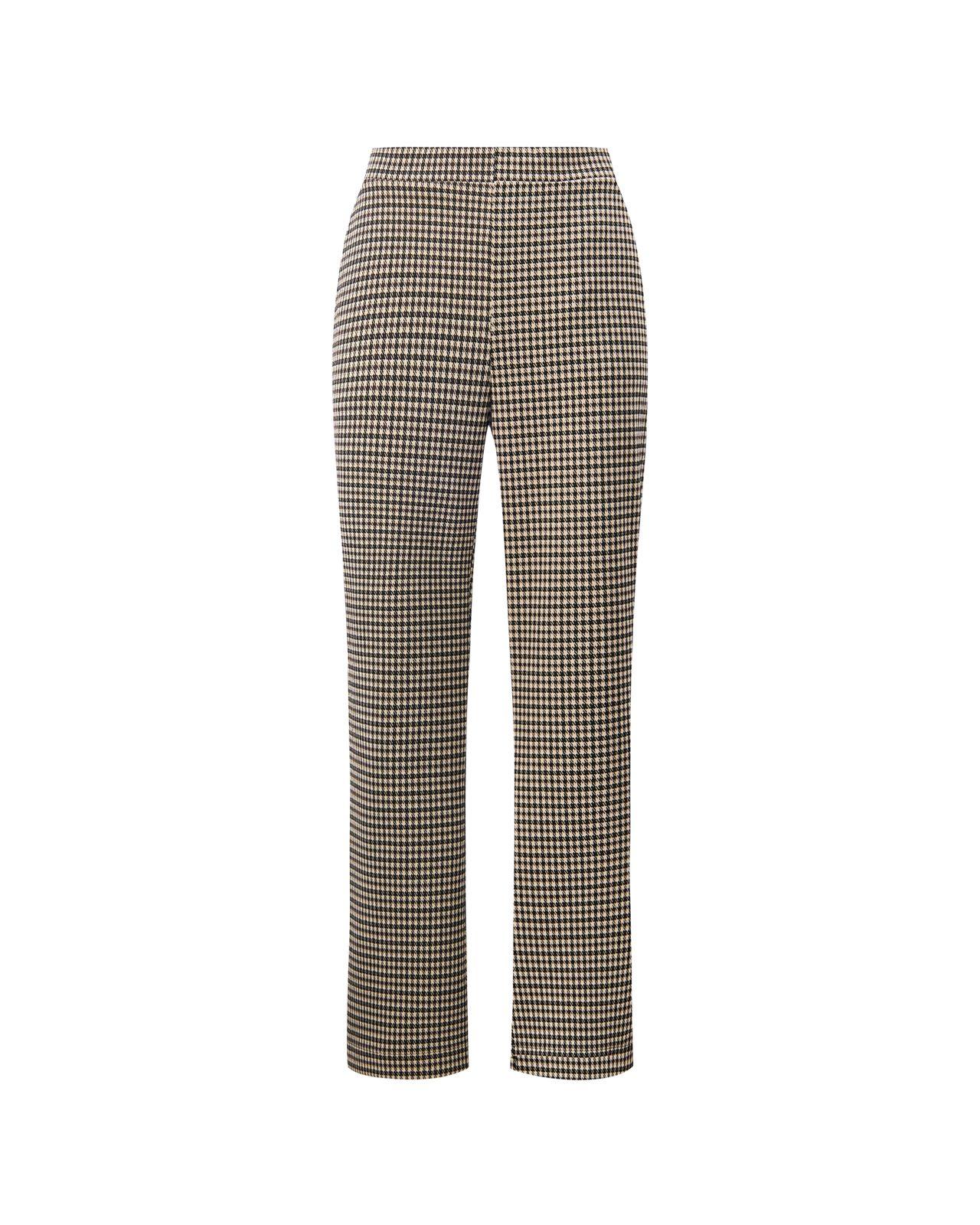 a woman wearing a black and white checkered pants