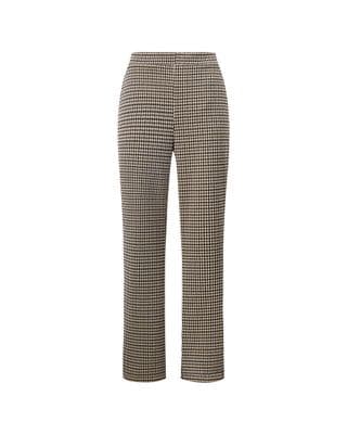 a woman wearing a black and white checkered pants