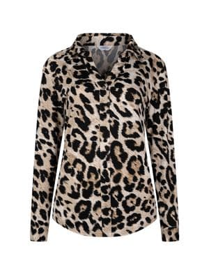 a woman wearing a leopard print shirt
