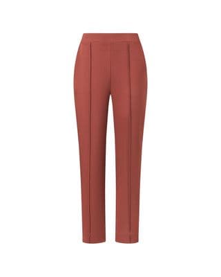 a picture of a woman wearing a red pants