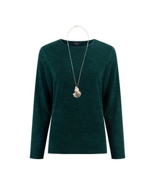 a woman wearing a green sweater and a necklace